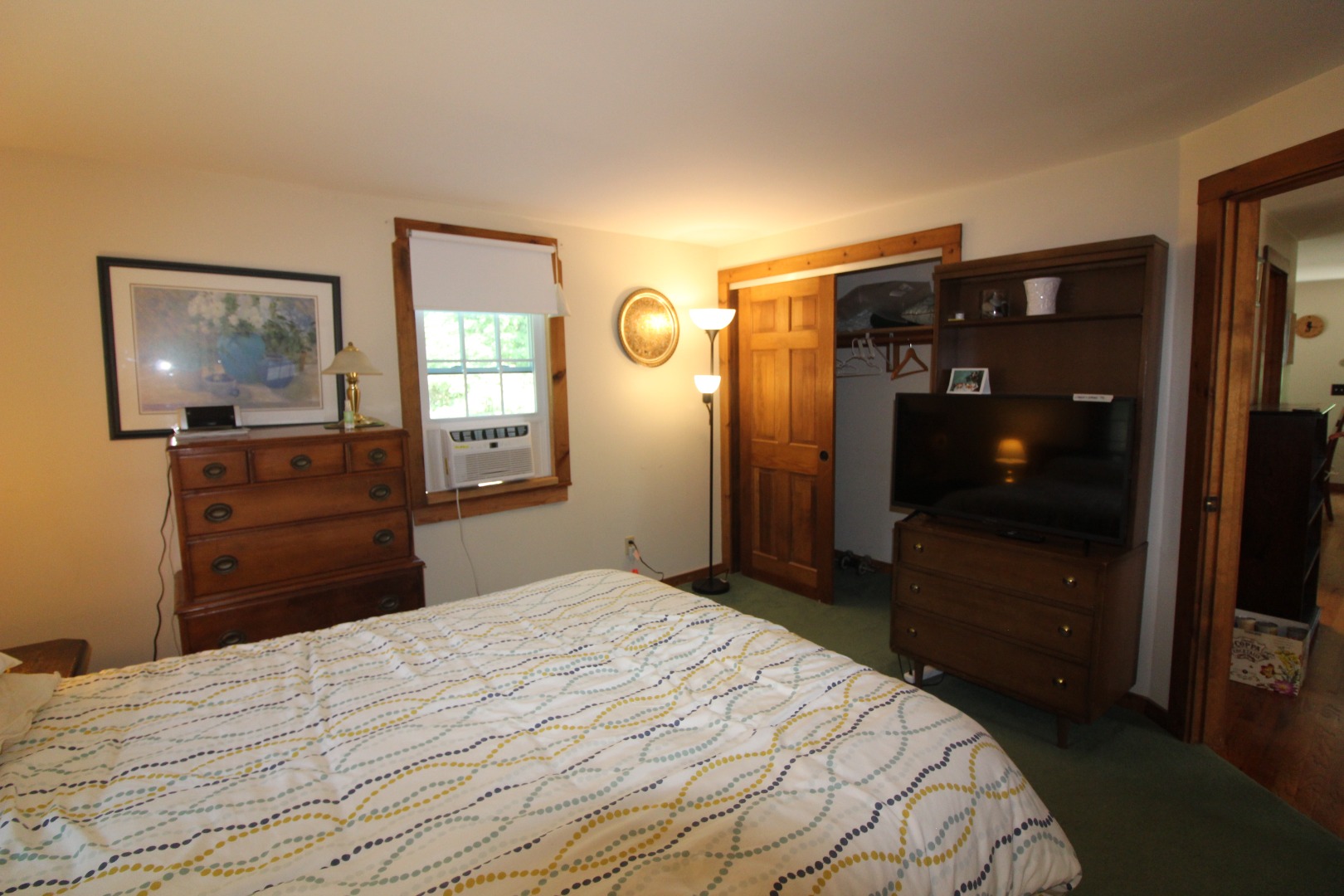 19 Vickers Street Edgartown, MA 02539 - Photo 8 of 16 a bedroom with a bed and a flat tv screen on dresser