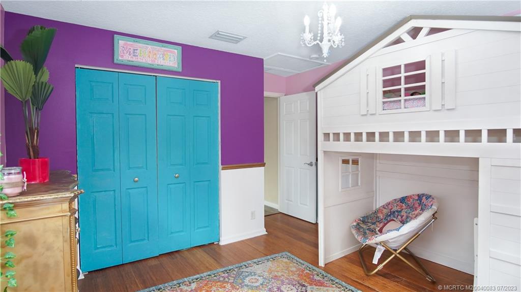 2440 Southwest Riviera Road Stuart, FL 34997 - Photo 11 of 18 a view of front door and bedroom