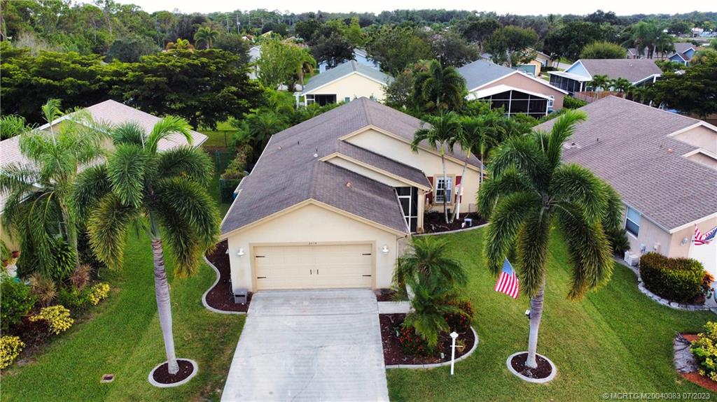 2440 Southwest Riviera Road Stuart, FL 34997 - Photo 17 of 18 an aerial view of multiple houses with yard