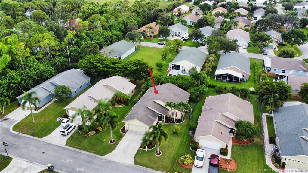 2440 Southwest Riviera Road Stuart, FL 34997 - Photo 18 of 18 an aerial view of multiple houses with yard