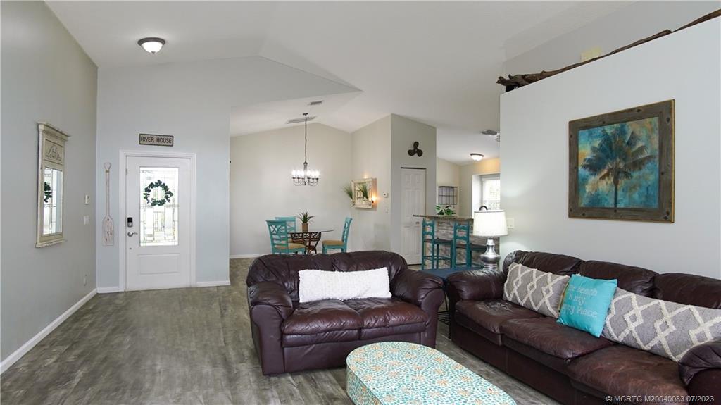 2440 Southwest Riviera Road Stuart, FL 34997 - Photo 2 of 18 a living room with furniture