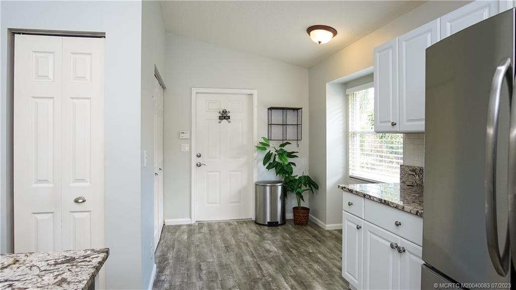 2440 Southwest Riviera Road Stuart, FL 34997 - Photo 6 of 18 a room with window and wooden floor