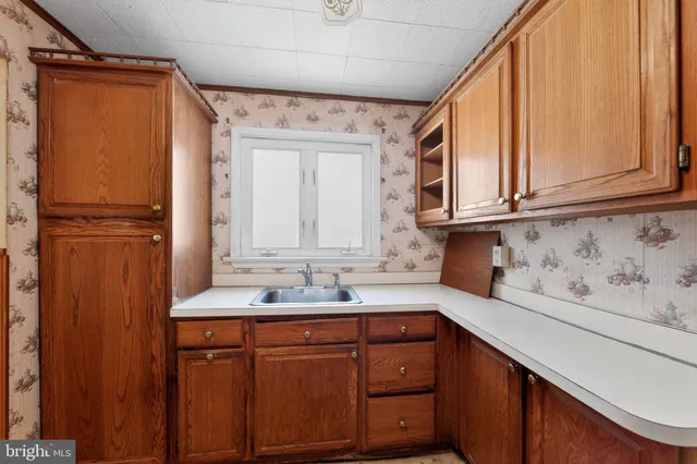 a kitchen with stainless steel appliances granite countertop a refrigerator and cabinets