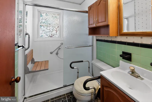 a bathroom with a sink toilet and mirror