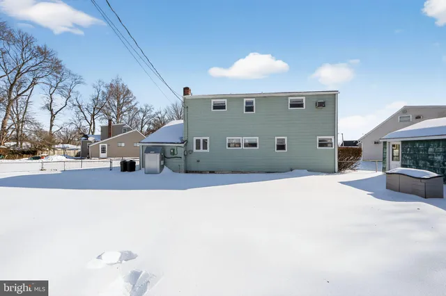a view of the house with a snow