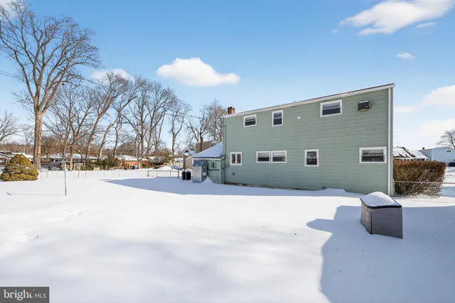 a view of a house with a snow in the yard