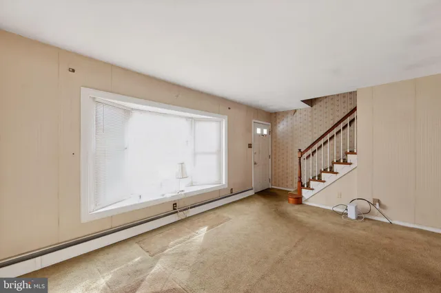 a view of an empty room with windows