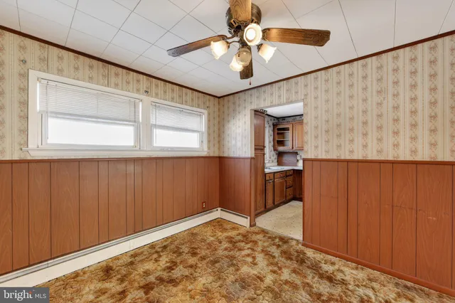 a view of a livingroom with a window and furniture