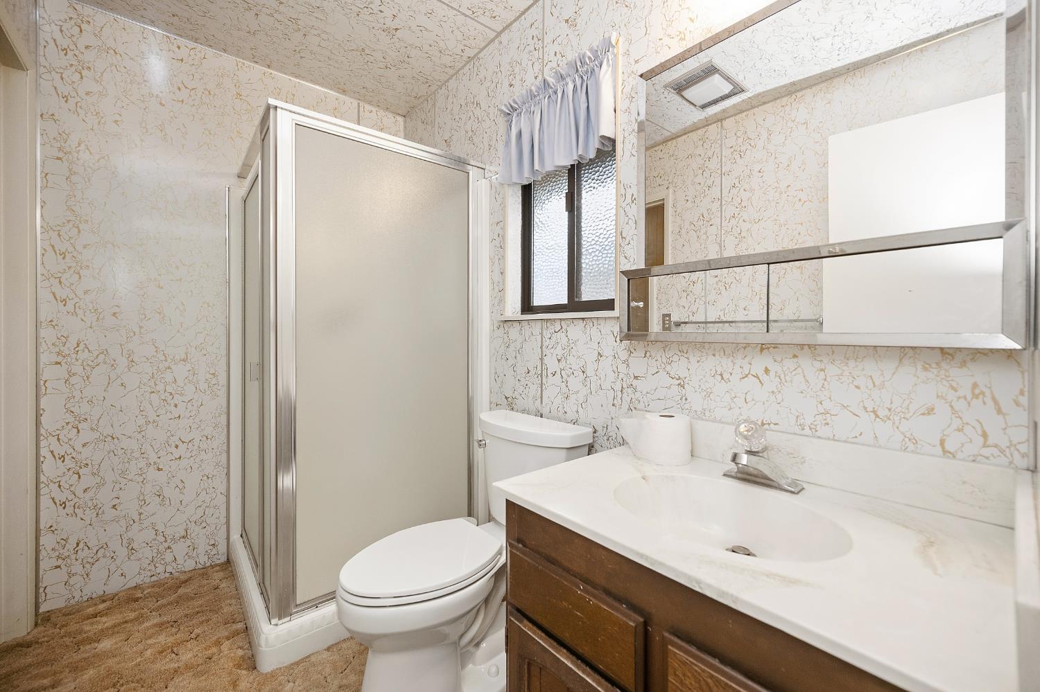7349 Green Valley Road Placerville, CA 95667 - Photo 41 of 41 ADU bathroom with walk in shower stall. Window to side of home.