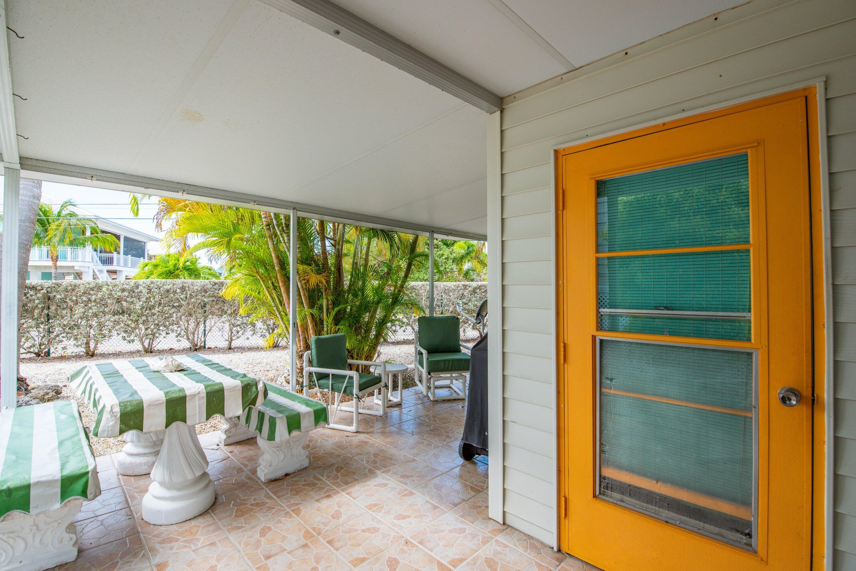 701 Spanish Main Drive, Unit 21 Cudjoe, FL 33042 - Photo 20 of 49 a room with furniture and a large window
