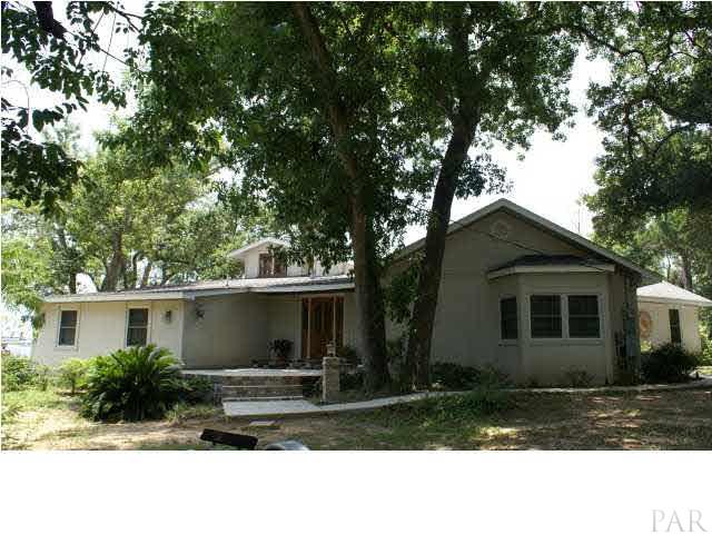 Front view of the tree shaded home