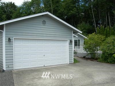 23321 12th Place West Bothell, WA 98021 - Photo 1 of 1 a small white house with a white roof and yard