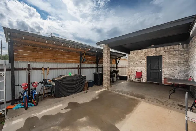 a view of a garage with parked cars