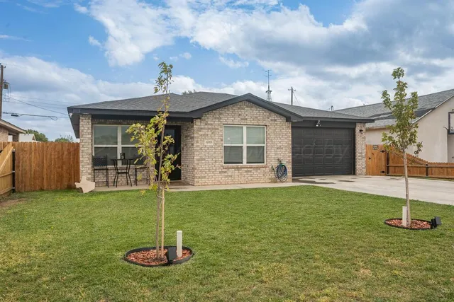 a house with garden in front of it