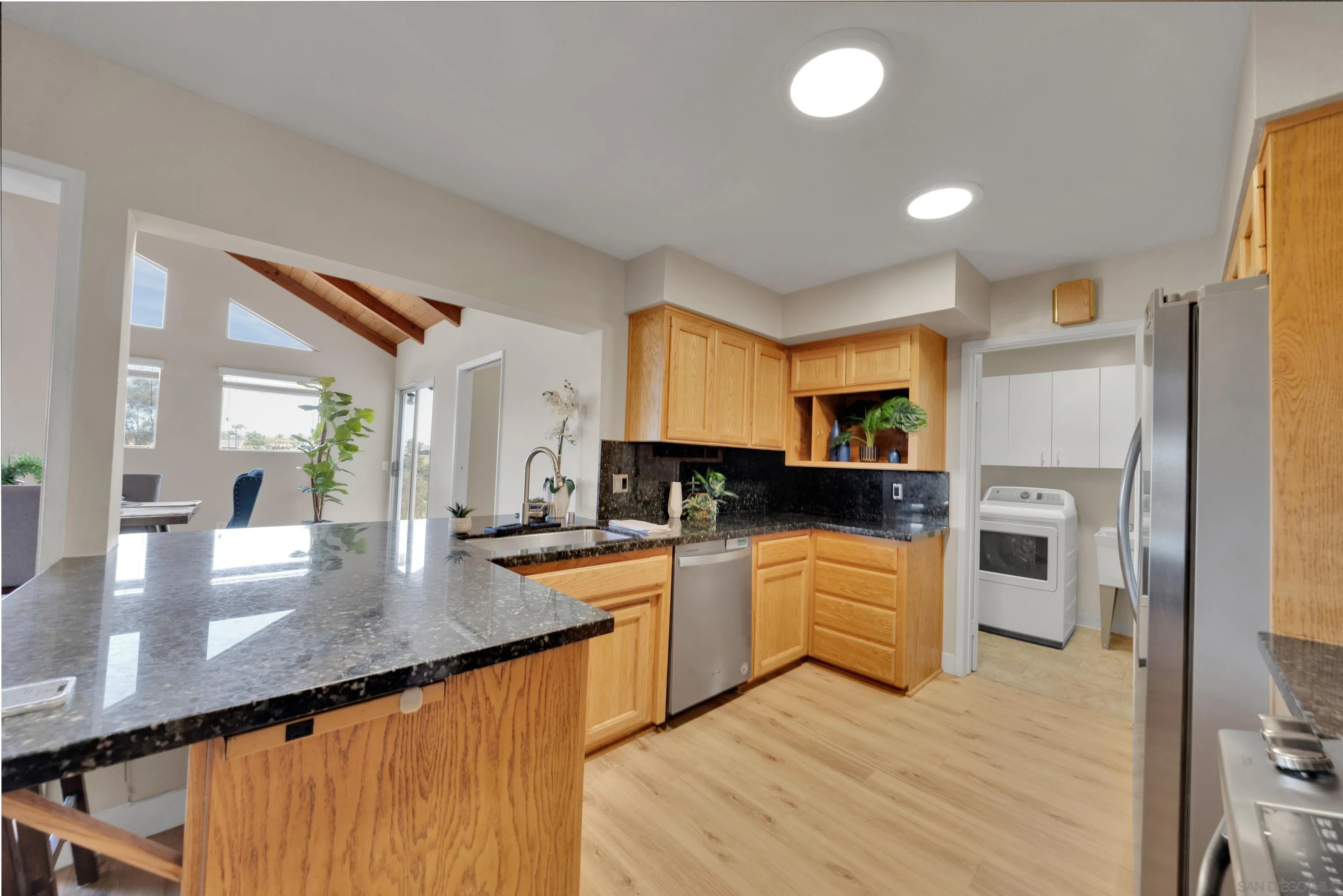 13710 Ahwahnee Way Poway, CA 92064 - Photo 12 of 43 a kitchen with a sink a counter top space stainless steel appliances and cabinets