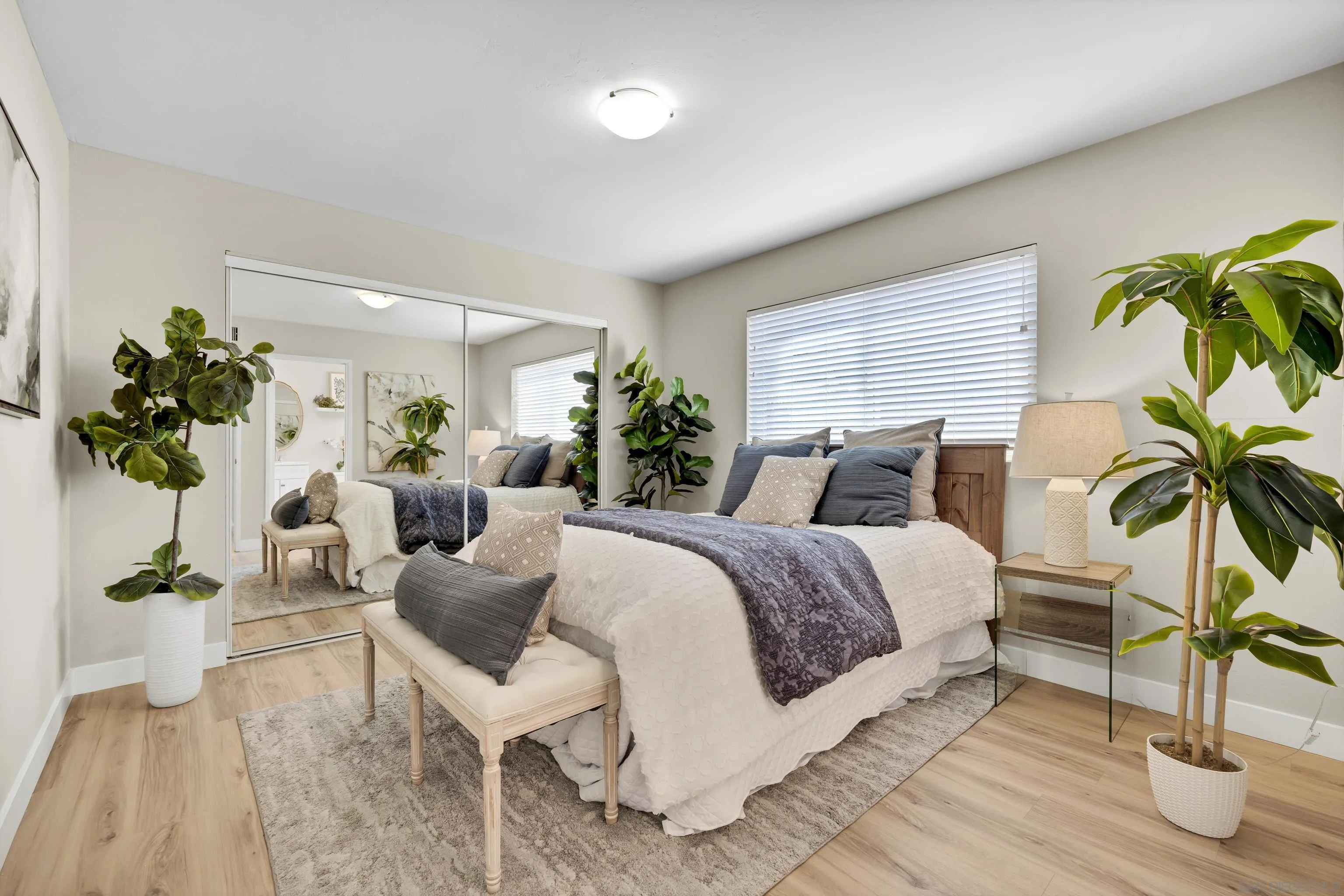 13710 Ahwahnee Way Poway, CA 92064 - Photo 17 of 43 a bed room with a bed and a potted plant