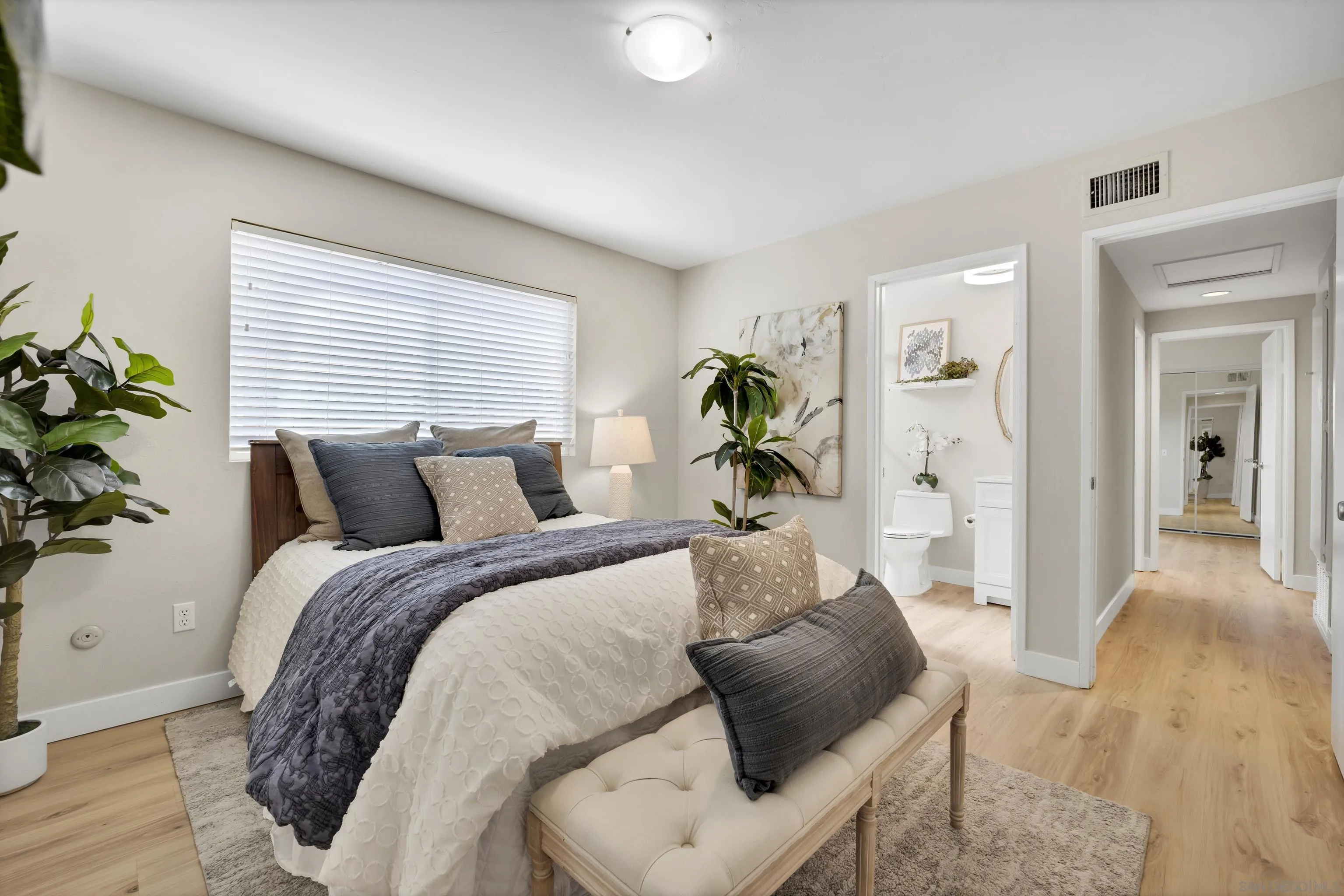 13710 Ahwahnee Way Poway, CA 92064 - Photo 18 of 43 a bed room with a bed and a couch