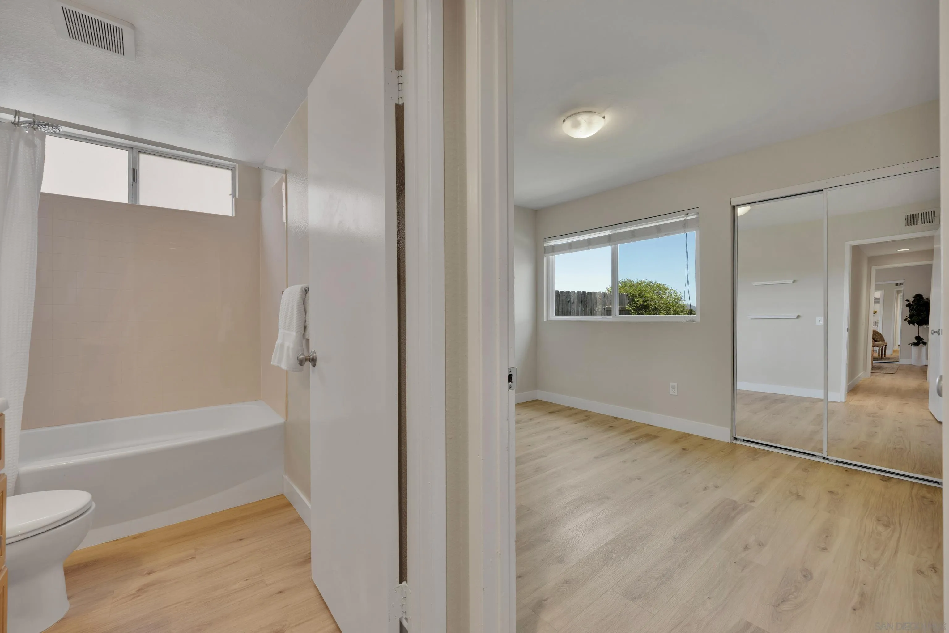 13710 Ahwahnee Way Poway, CA 92064 - Photo 22 of 43 a bathroom with a bathtub and a toilet
