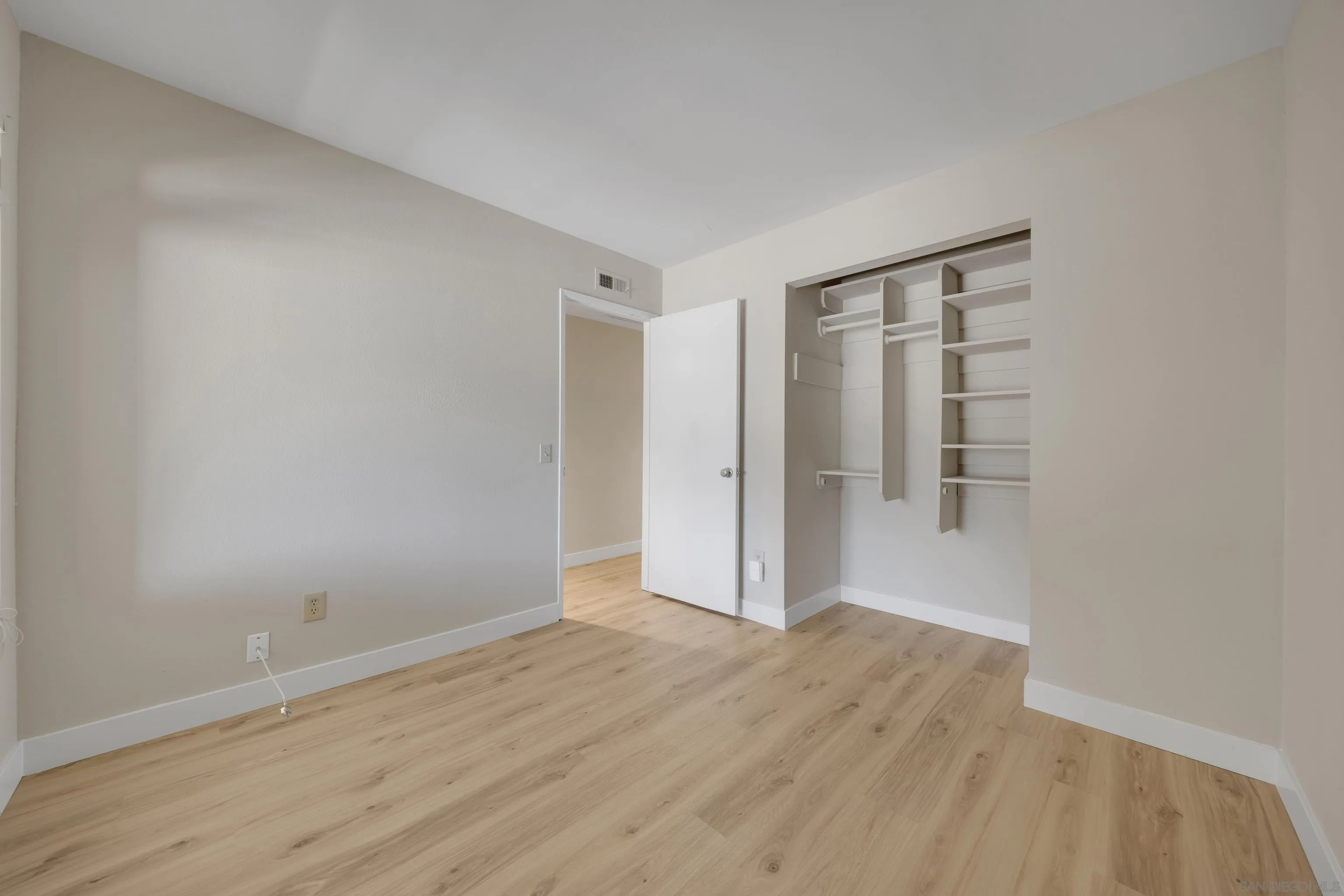 13710 Ahwahnee Way Poway, CA 92064 - Photo 26 of 43 a view of an empty room with wooden floor and closet