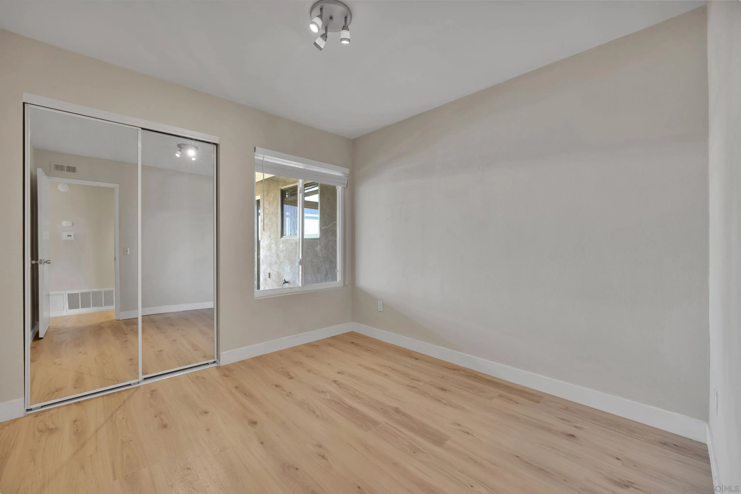 13710 Ahwahnee Way Poway, CA 92064 - Photo 28 of 43 wooden floor in an empty room with a window