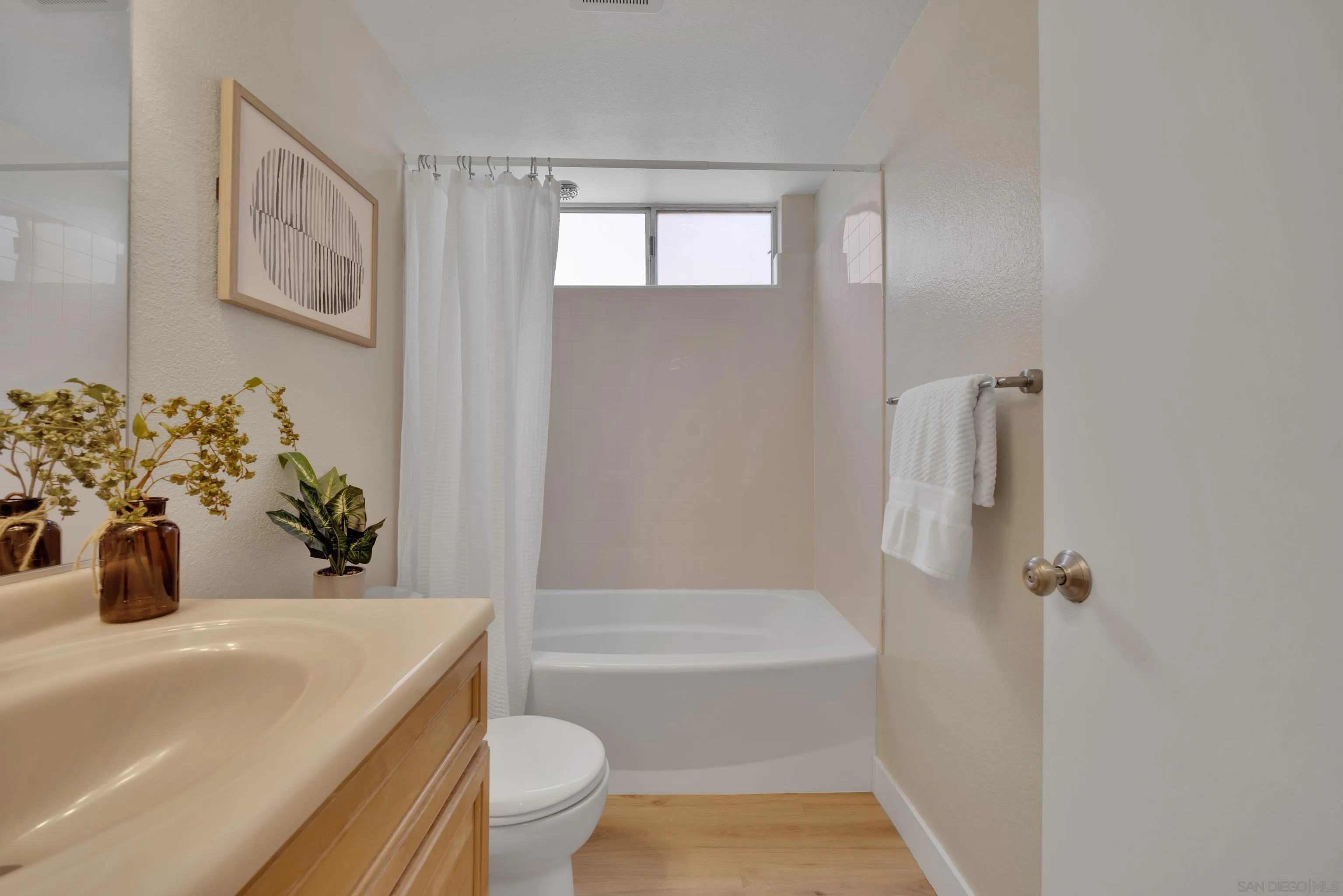 13710 Ahwahnee Way Poway, CA 92064 - Photo 30 of 43 a bathroom with a sink a toilet and shower