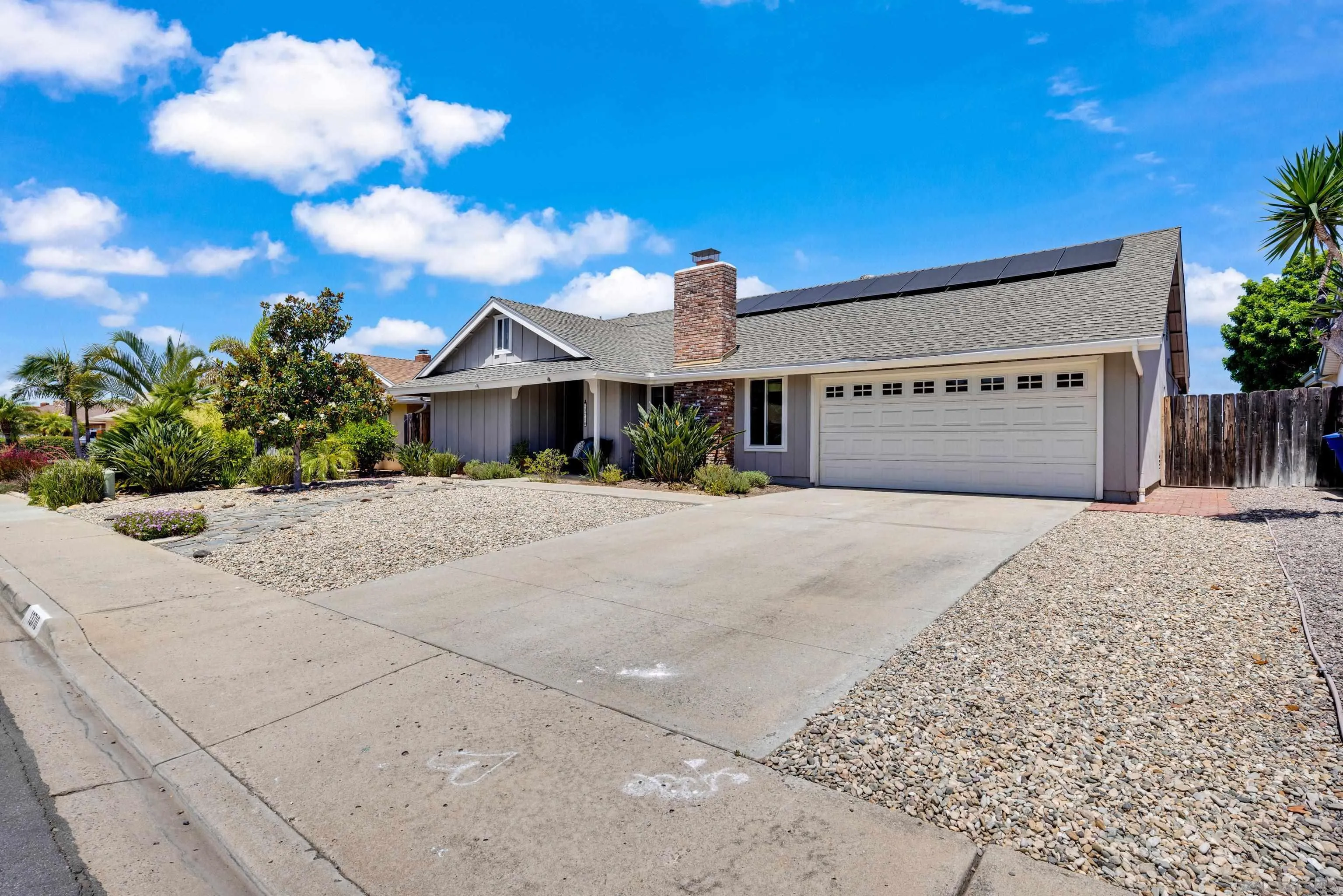 13710 Ahwahnee Way Poway, CA 92064 - Photo 3 of 43 a front view of a house with a yard