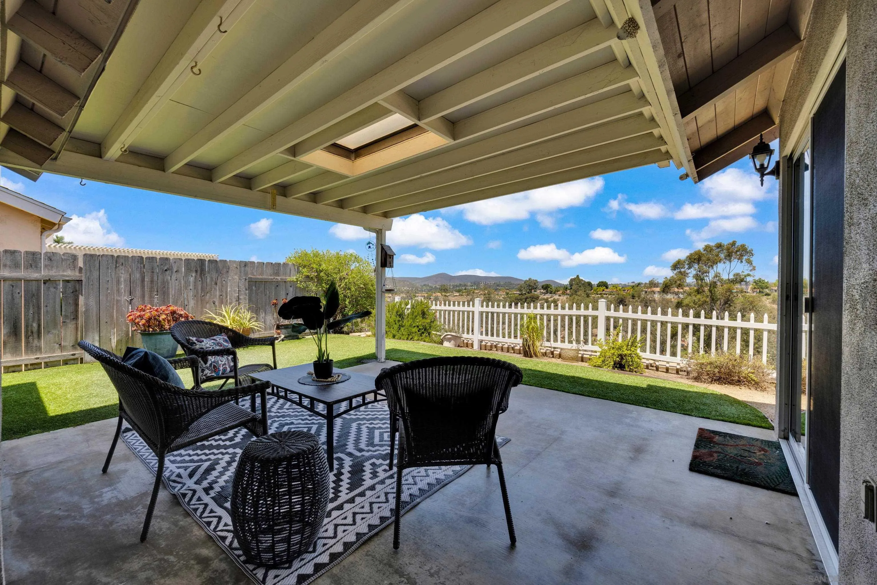 13710 Ahwahnee Way Poway, CA 92064 - Photo 33 of 43 a view of a porch with furniture and a yard
