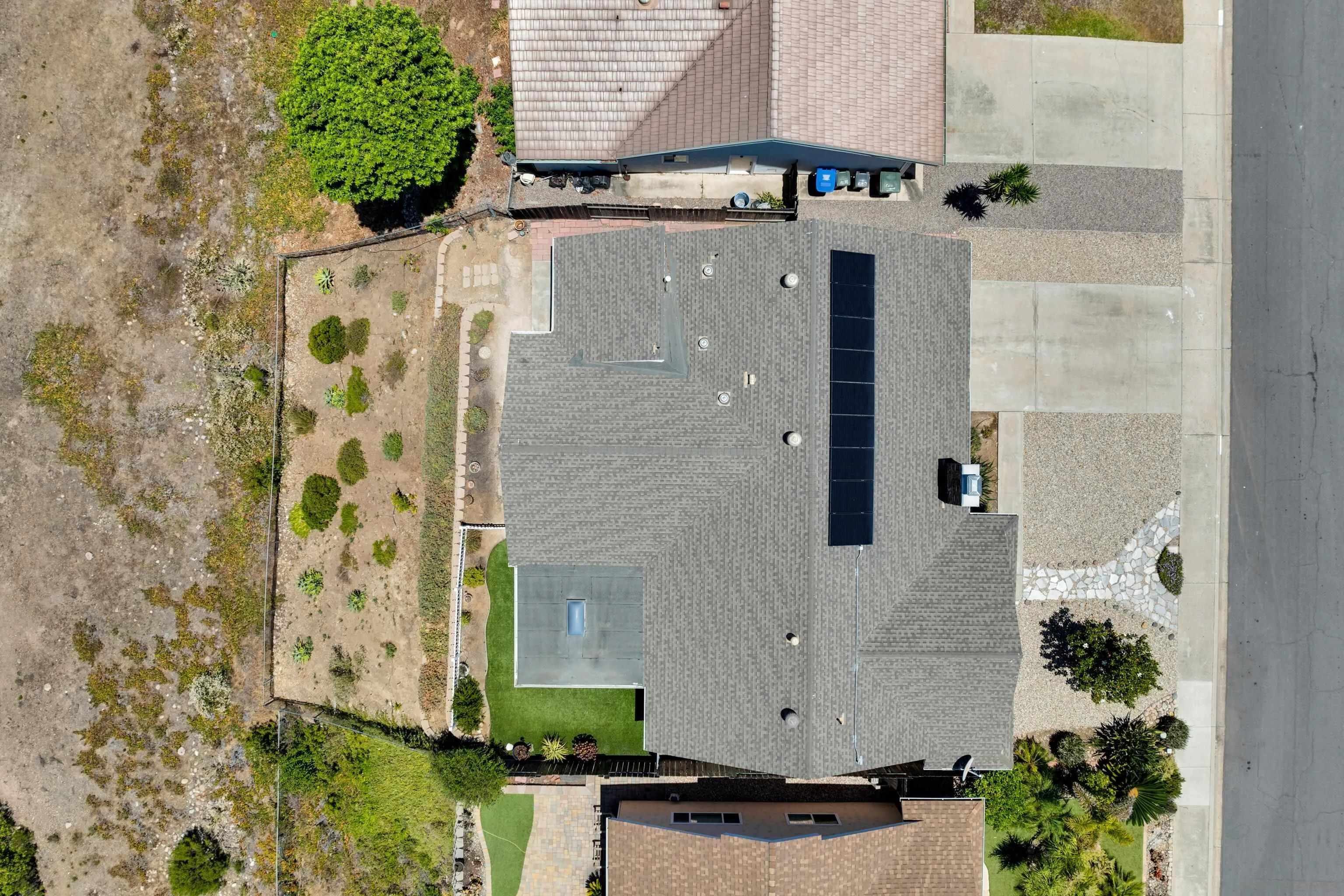 13710 Ahwahnee Way Poway, CA 92064 - Photo 38 of 43 an aerial view of a house with a backyard space and a car park
