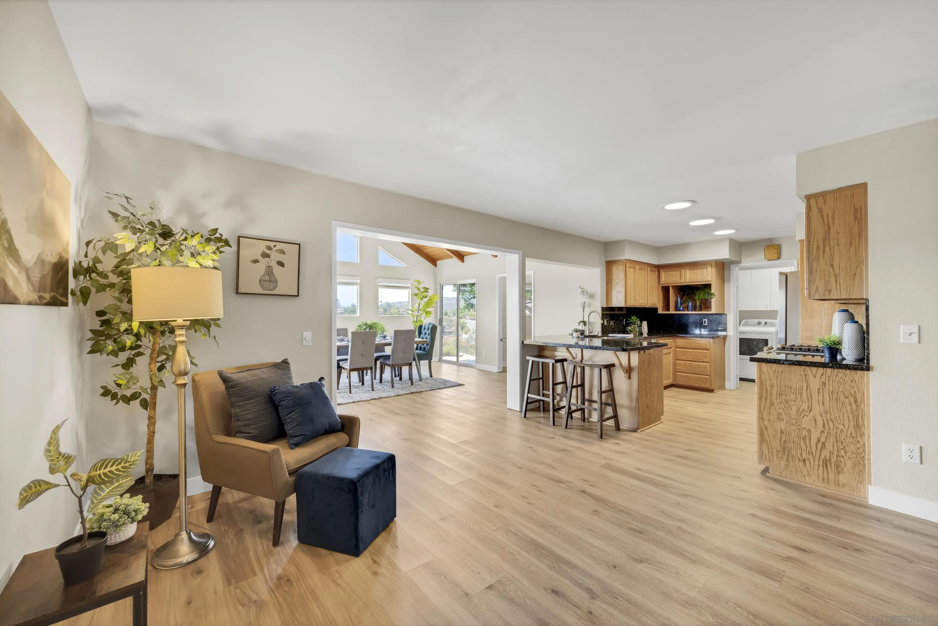 13710 Ahwahnee Way Poway, CA 92064 - Photo 8 of 43 a living room with furniture and a dining table with kitchen view