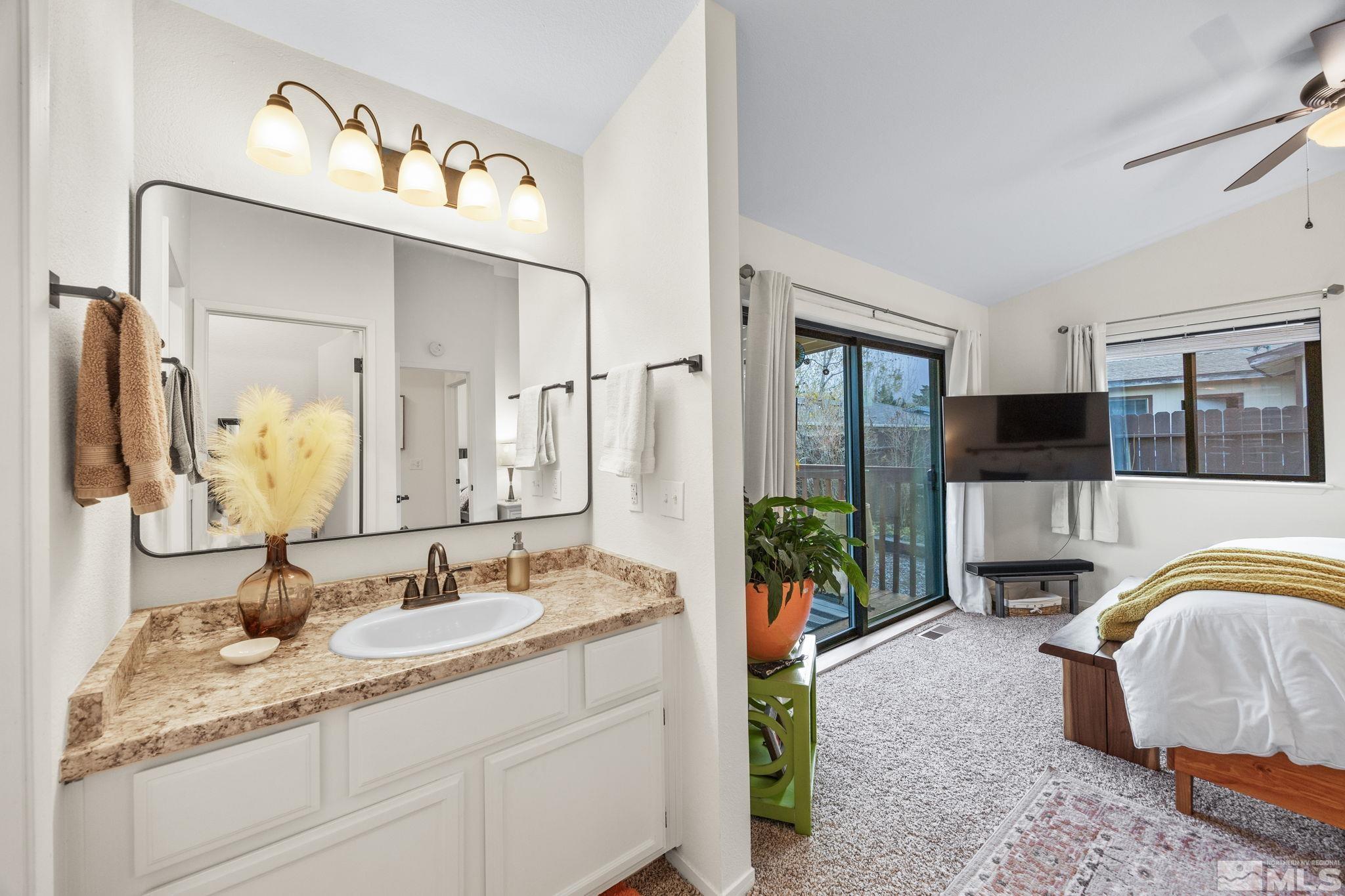 115 Stonecrest Drive Verdi, NV 89439 - Photo 18 of 28 a en suite spacious bathroom with a double vanity sink and a mirror