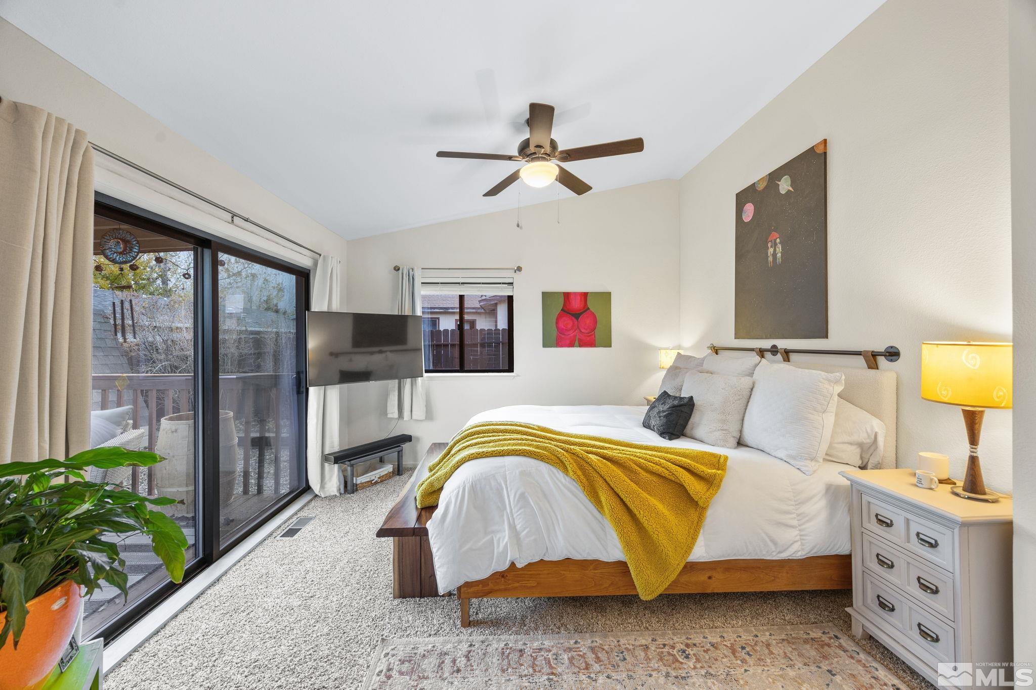 115 Stonecrest Drive Verdi, NV 89439 - Photo 21 of 28 a bedroom with a bed and ceiling fan