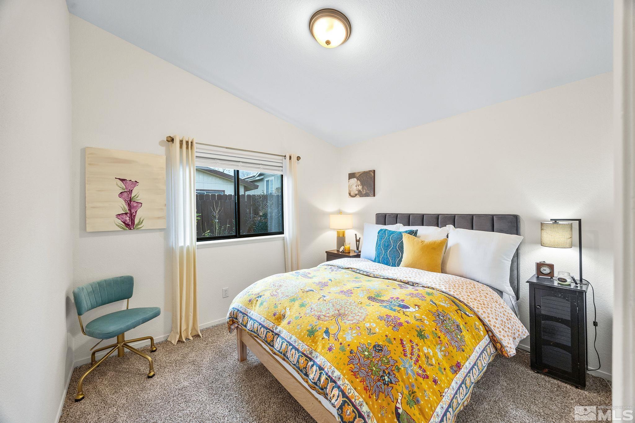 115 Stonecrest Drive Verdi, NV 89439 - Photo 22 of 28 a bed room with a bed and a chair