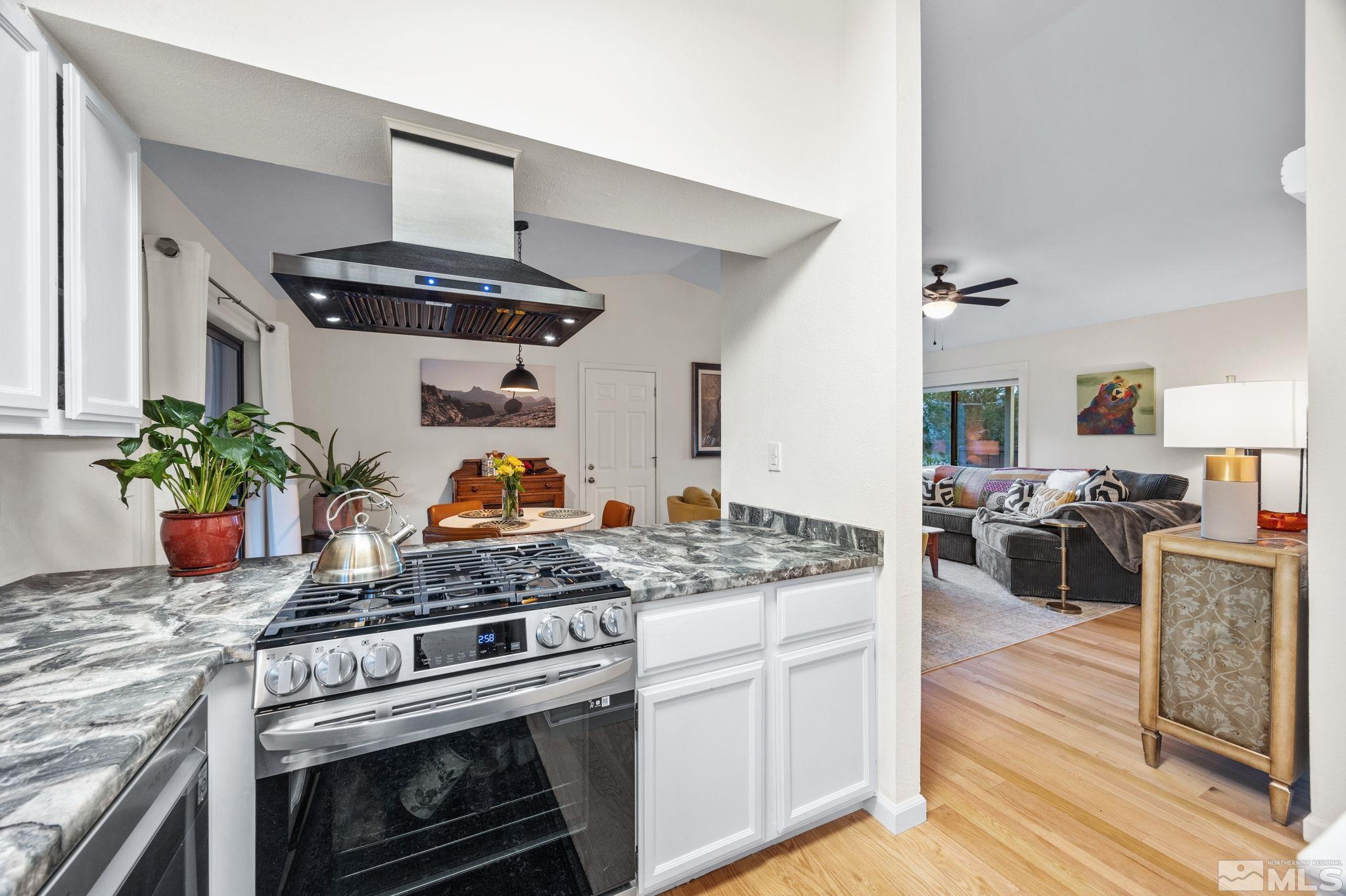 115 Stonecrest Drive Verdi, NV 89439 - Photo 8 of 28 a kitchen with stainless steel appliances granite countertop a stove and a sink