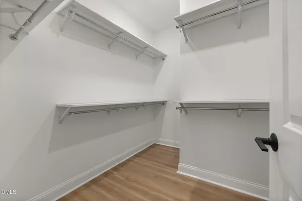 a bathroom with a double vanity sink mirror and shower