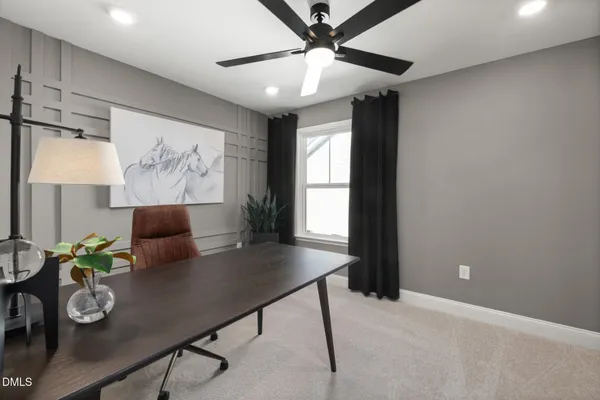 a view of a livingroom with furniture and a potted plant