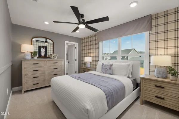 a bedroom with a large bed and a large window