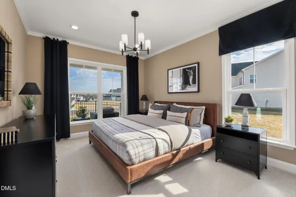 a bedroom with a large bed and a dresser