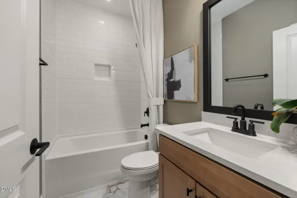 a spacious bedroom with a bed and a large window