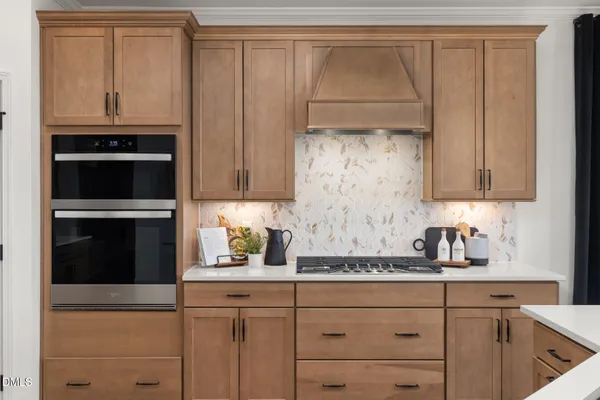 a kitchen with sink refrigerator and cabinets