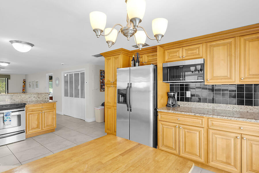 303 Sombrero Beach Road Marathon, FL 33050 - Photo 20 of 84 Side B-kitchen and dining flow