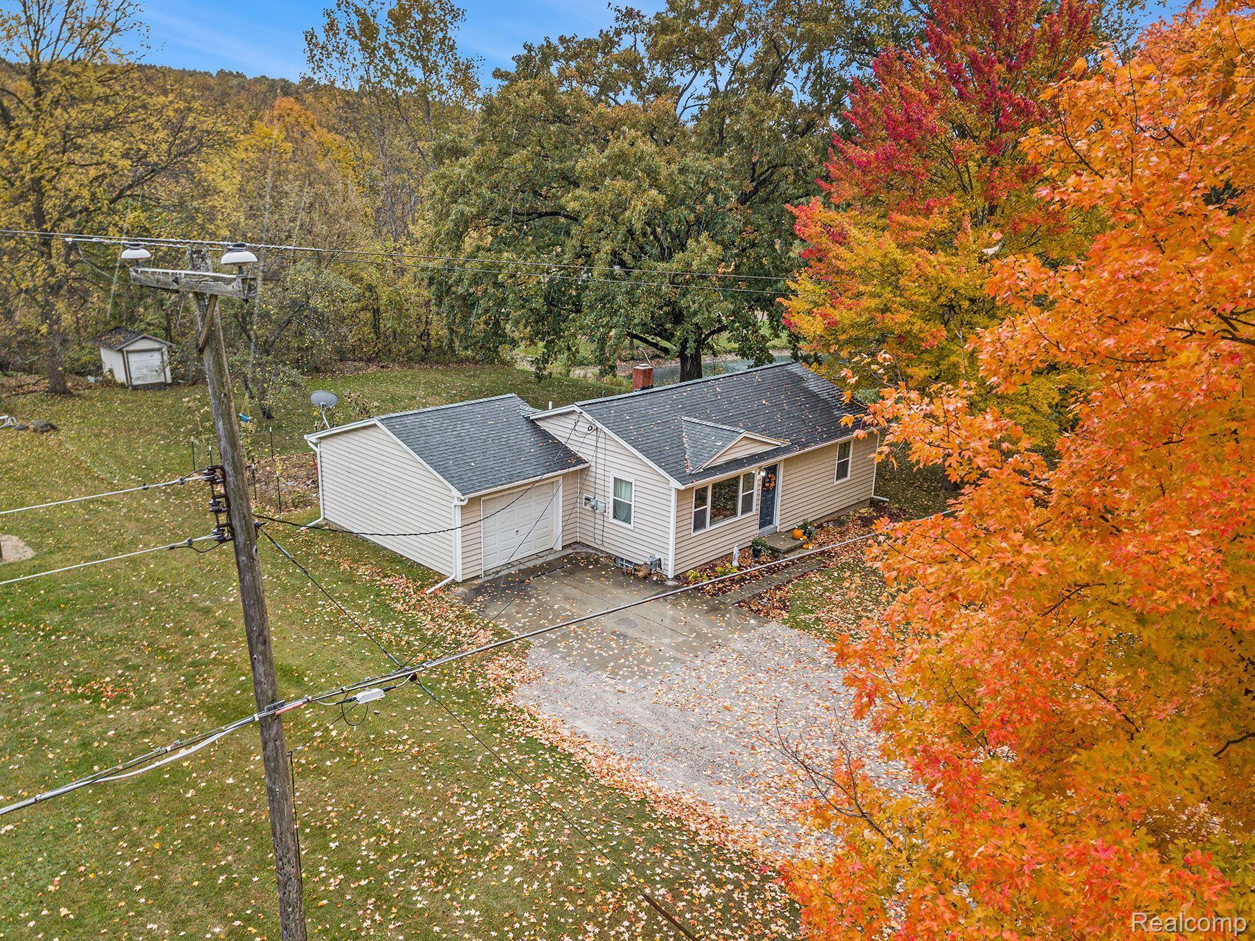 11158 Foley Road Fenton, MI 48430 - Photo 14 of 18 on 0.42 acres with mature trees.