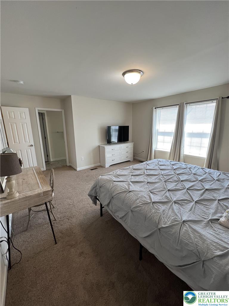 5380 Jutland Road Allentown, PA 18104 - Photo 19 of 27 Well-lit room featuring ample window light and durable carpeting throughout.