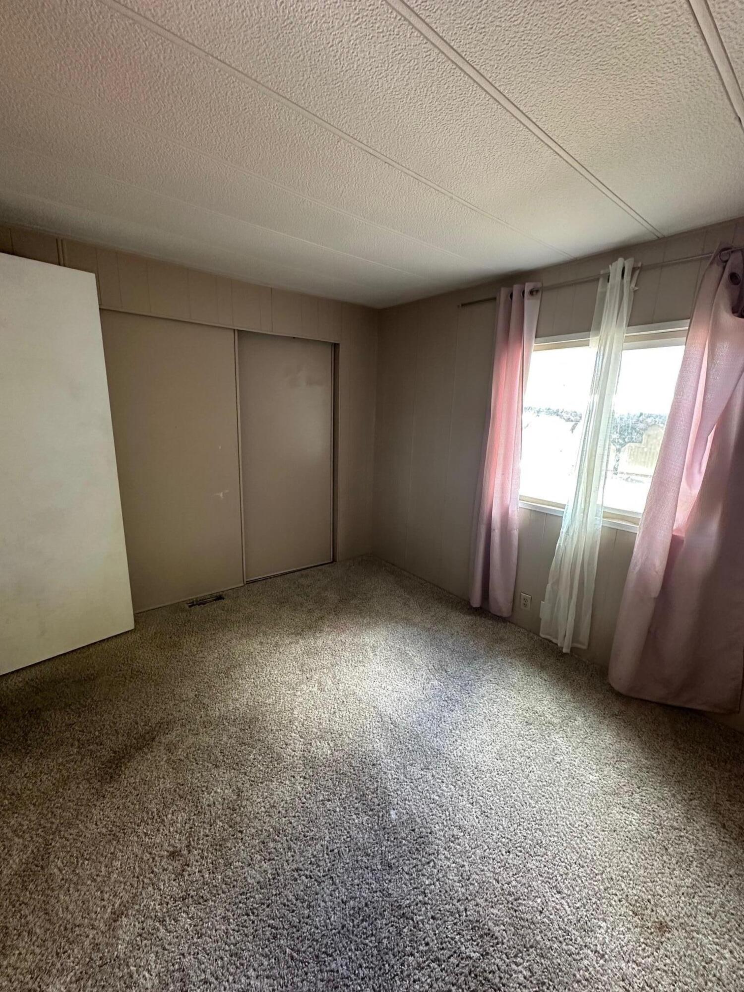 421 Stevens Road, Unit 52 Eagle Point, OR 97524 - Photo 12 of 18 an empty room with windows