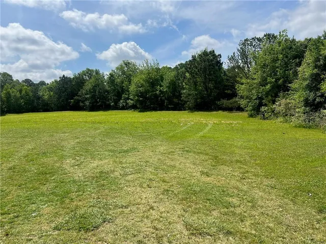 a view of a field with an outdoor space