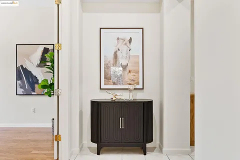 a kitchen with a sink dining table and chairs