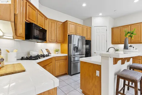 a bedroom with a bed and a potted plant