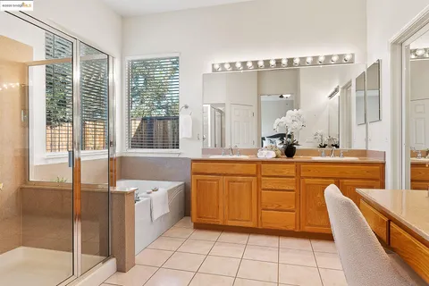 a bedroom with furniture and a mirror