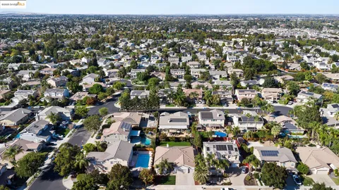 an aerial view of city and lake