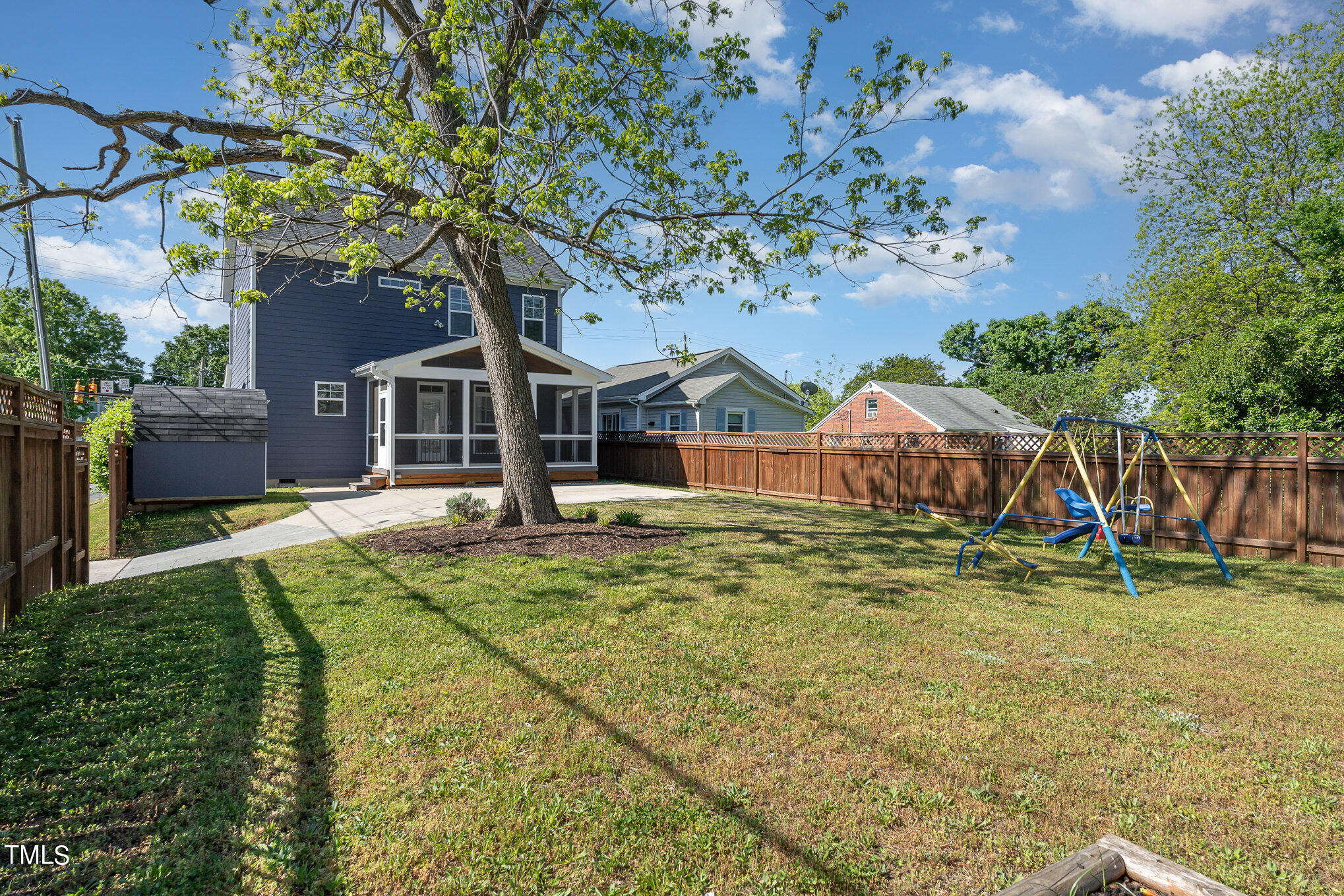 719 East Lenoir Street Raleigh, NC 27601 - Photo 14 of 16 a front view of a house with a yard table and chairs