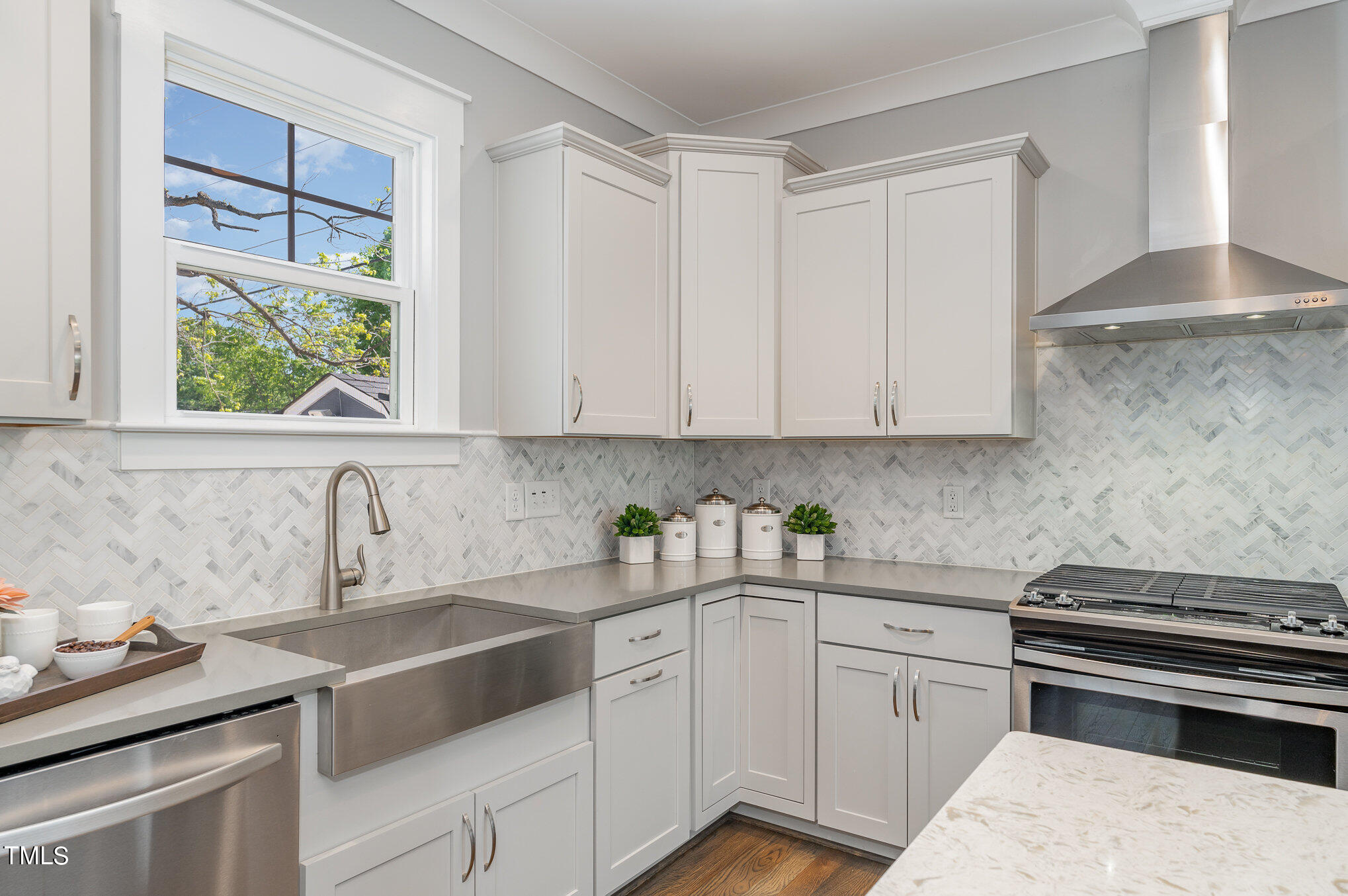 719 East Lenoir Street Raleigh, NC 27601 - Photo 4 of 16 a kitchen with a sink stove and cabinets